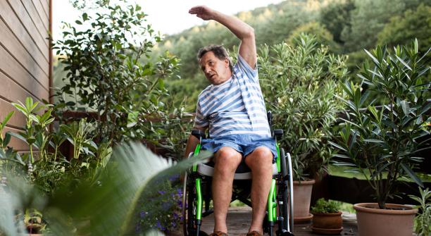 Man in a wheelchair stretching