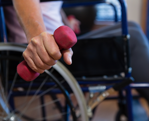 iStock 837816348 exercise weights dumbell wheelchair fitness c