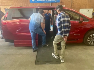 Attendees looking into an accessible van